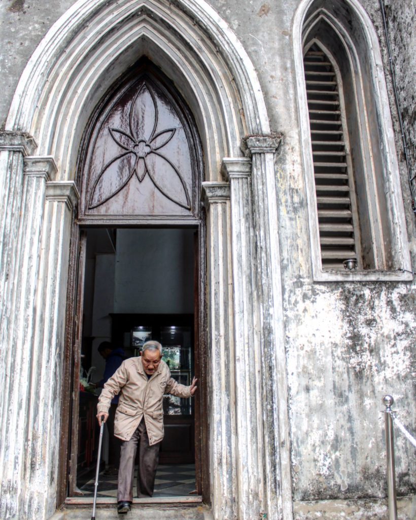 Lucky Shot of Unknown Man Leaving the Cathedral.